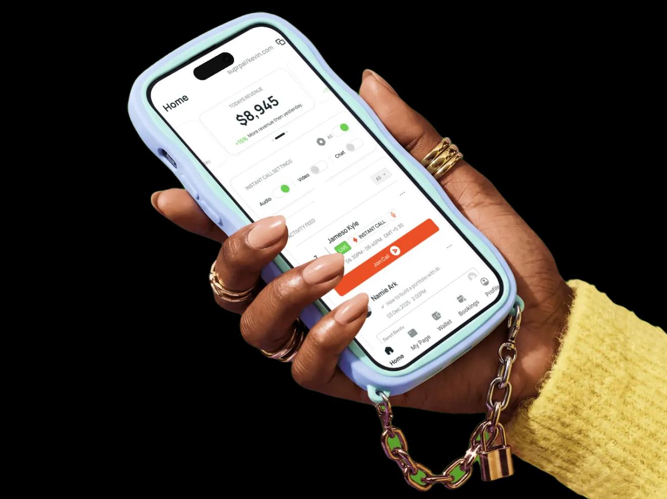 Hand holding a phone showing the SuprPal creator dashboard